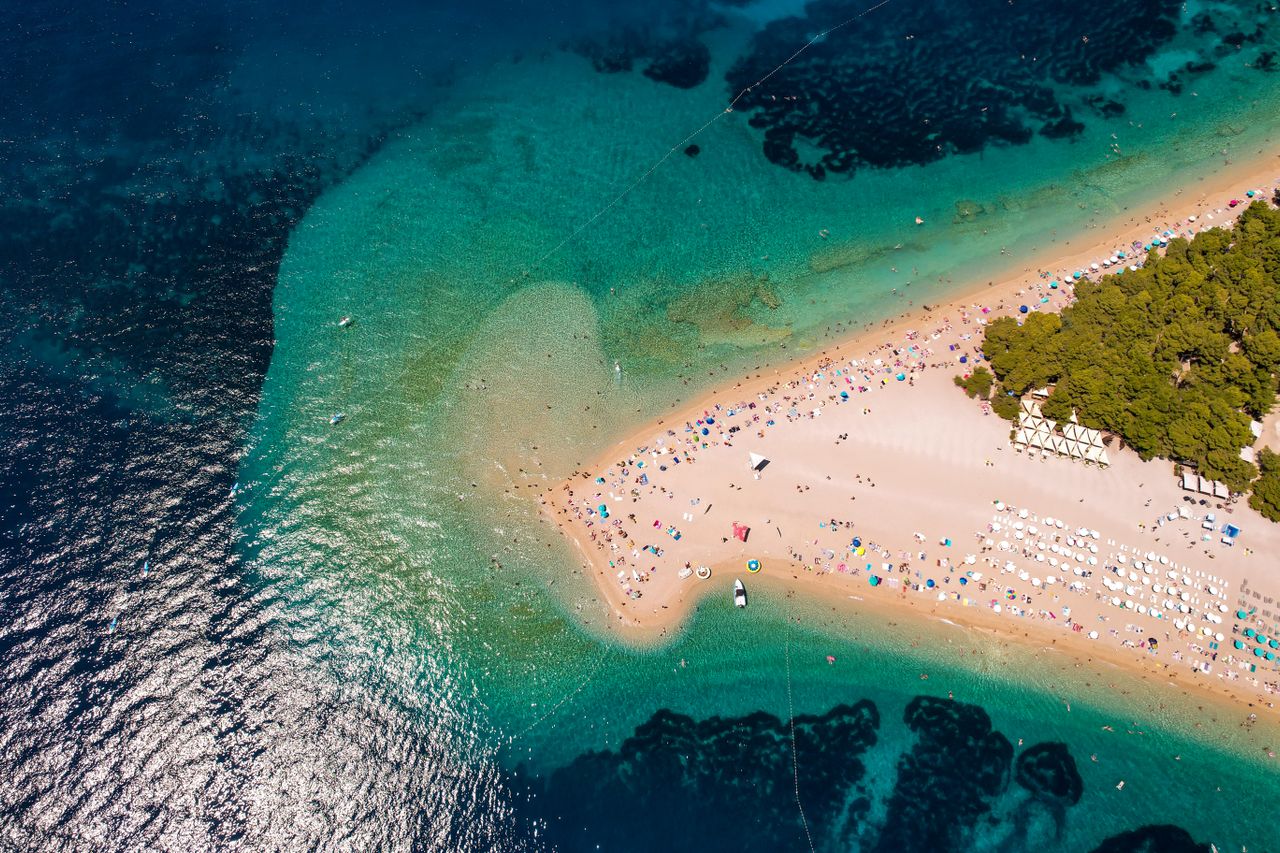 Crystal clear Adriatic Sea beach in Croatia with turquoise water
